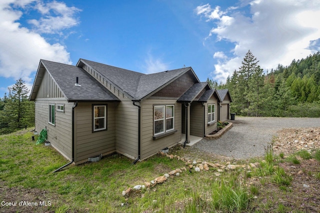 27968 N Timber Ridge Rd, Rathdrum, ID 83858 - view of side of property with a shingled roof