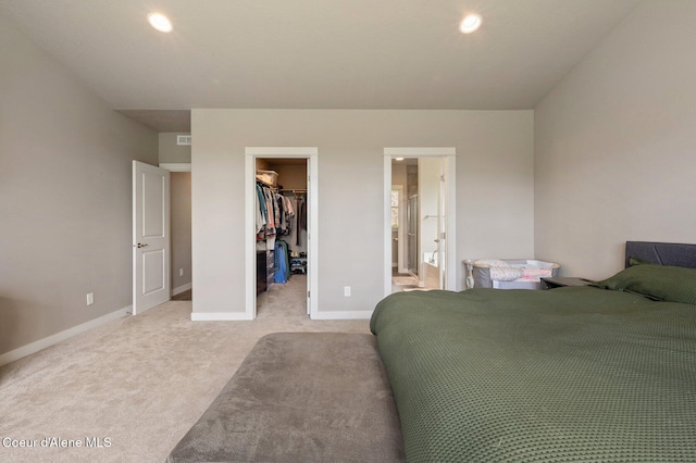 27968 N Timber Ridge Rd, Rathdrum, ID 83858 - bedroom with a walk in closet, light carpet, a closet, baseboards, and connected bathroom