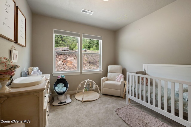 27968 N Timber Ridge Rd, Rathdrum, ID 83858 - bedroom featuring a crib, carpet, and baseboards