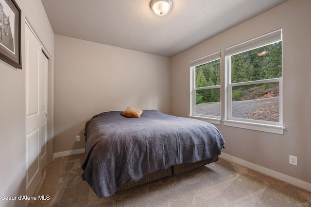 27968 N Timber Ridge Rd, Rathdrum, ID 83858 - carpeted bedroom featuring baseboards