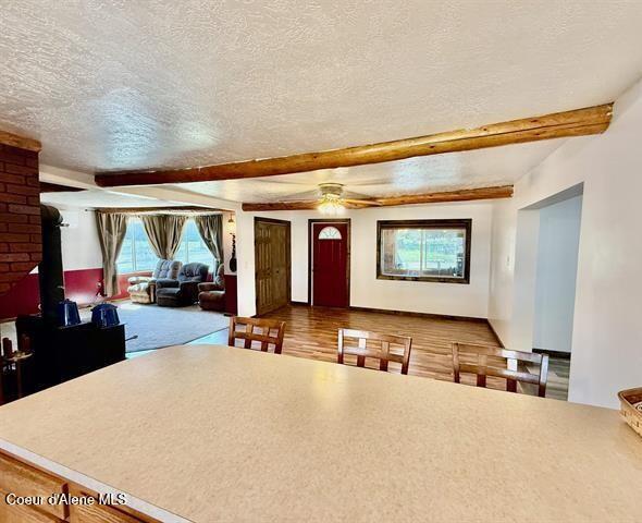 602 Spalding Ave, Winchester, ID 83555 - kitchen with a textured ceiling, beamed ceiling, ceiling fan, and wood finished floors