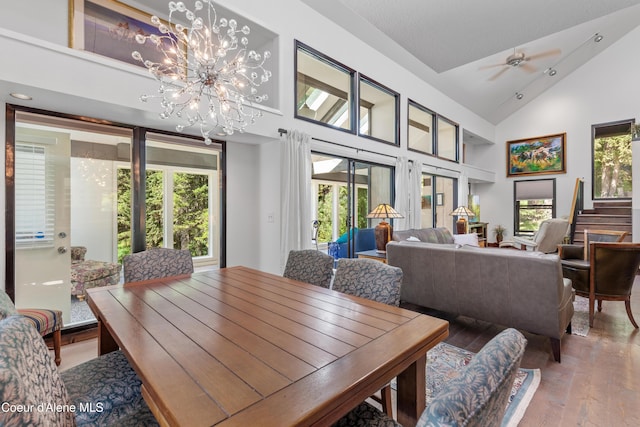 5005 W Cougar Estates Rd, Coeur Dalene, ID 83814 - dining room with hardwood / wood-style flooring, high vaulted ceiling, a chandelier, and recessed lighting