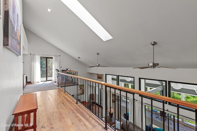 5005 W Cougar Estates Rd, Coeur Dalene, ID 83814 - hallway with a skylight, wood finished floors, recessed lighting, and high vaulted ceiling
