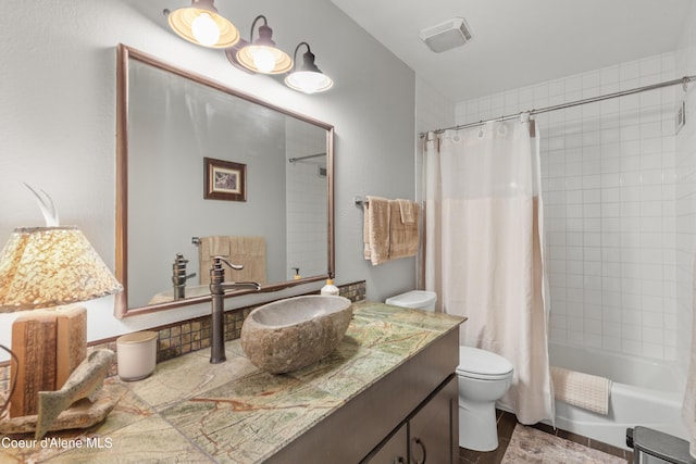5005 W Cougar Estates Rd, Coeur Dalene, ID 83814 - full bathroom with toilet, vanity, and shower / bath combo