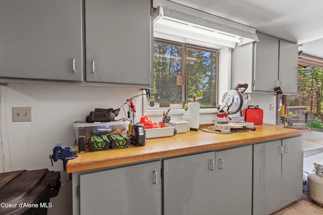 5005 W Cougar Estates Rd, Coeur Dalene, ID 83814 - kitchen with light countertops, plenty of natural light, and gray cabinetry