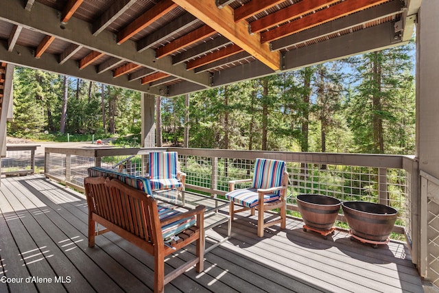 5005 W Cougar Estates Rd, Coeur Dalene, ID 83814 - wooden deck featuring view of wooded area