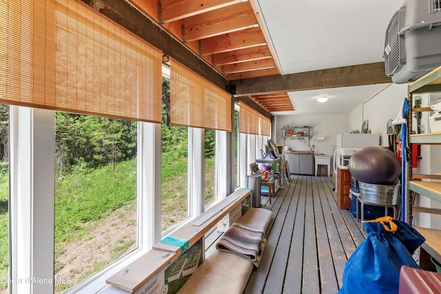5005 W Cougar Estates Rd, Coeur Dalene, ID 83814 - sunroom / solarium featuring plenty of natural light, wood-type flooring, and a wall mounted air conditioner
