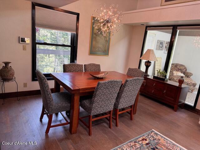 5005 W Cougar Estates Rd, Coeur Dalene, ID 83814 - dining room featuring wood finished floors, a chandelier, and baseboards