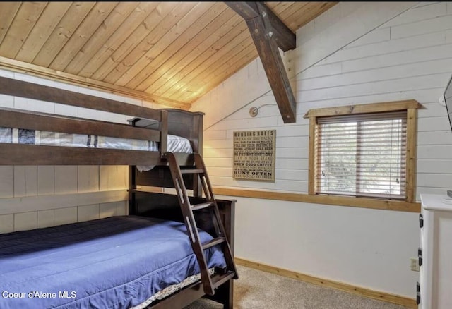 19118 St Joe River Rd, Calder, ID 83808 - bedroom featuring wood ceiling, wooden walls, carpet flooring, and baseboards