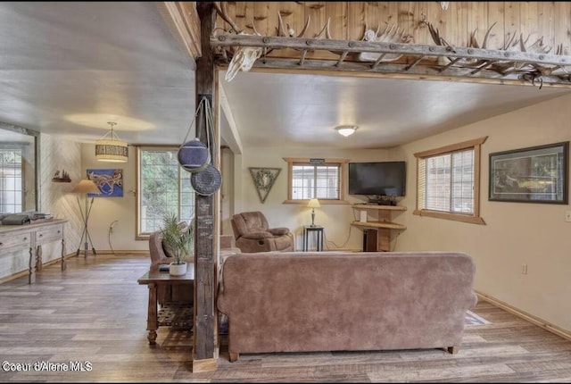 19118 St Joe River Rd, Calder, ID 83808 - living area with wood finished floors, plenty of natural light, and baseboards