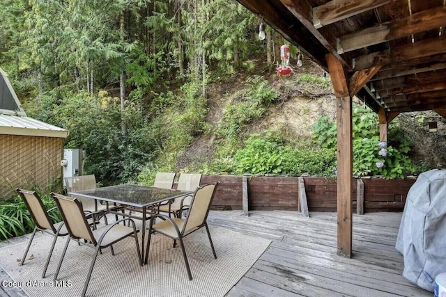 19118 St Joe River Rd, Calder, ID 83808 - wooden deck featuring outdoor dining space