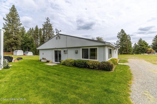 13744 N Hauser Lake Rd, Hauser, ID 83854 - back of property featuring a lawn