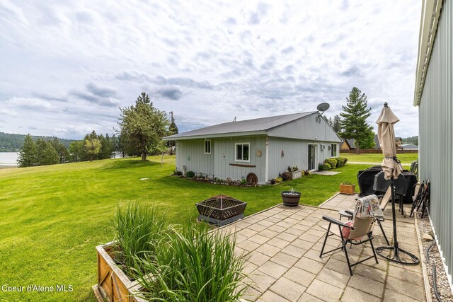 13744 N Hauser Lake Rd, Hauser, ID 83854 - view of patio / terrace featuring a fire pit