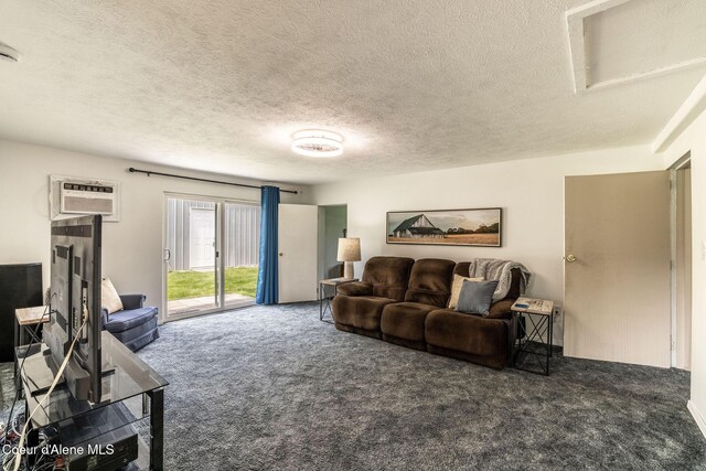13744 N Hauser Lake Rd, Hauser, ID 83854 - living area featuring carpet flooring, a textured ceiling, and an AC wall unit