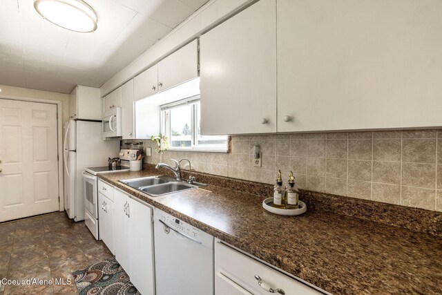 13744 N Hauser Lake Rd, Hauser, ID 83854 - kitchen featuring white appliances, a sink, dark countertops, white cabinetry, and decorative backsplash