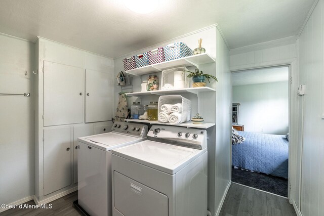 13744 N Hauser Lake Rd, Hauser, ID 83854 - laundry area featuring independent washer and dryer, dark wood-style floors, crown molding, and baseboards