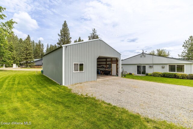 13744 N Hauser Lake Rd, Hauser, ID 83854 - view of pole building featuring a lawn and driveway