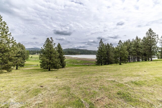 13744 N Hauser Lake Rd, Hauser, ID 83854 - view of green lawn with a water view and a view of rural / pastoral area