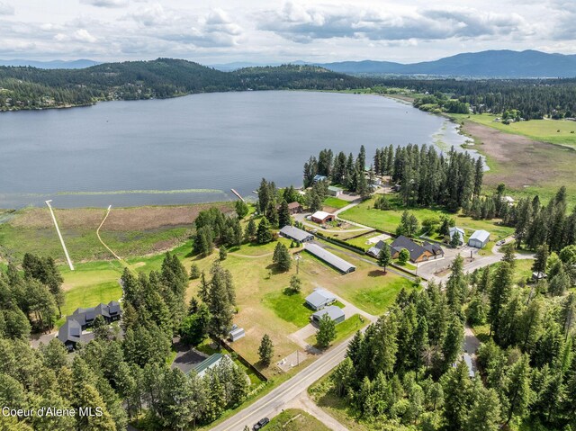 13744 N Hauser Lake Rd, Hauser, ID 83854 - drone / aerial view of a water and mountain view and a heavily wooded area