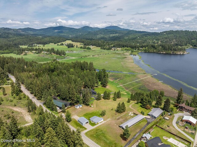 13744 N Hauser Lake Rd, Hauser, ID 83854 - aerial overview of property's location featuring a water and mountain view and a heavily wooded area