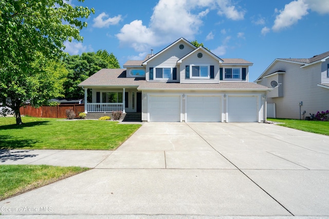 1800 N Willamette Dr, Post Falls, ID 83854 - traditional-style house with a porch, an attached garage, and driveway