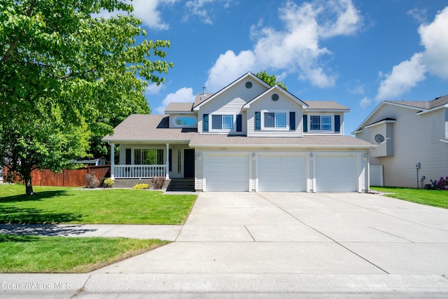 1800 N Willamette Dr, Post Falls, ID 83854 - view of front of home with driveway, a garage, and a porch