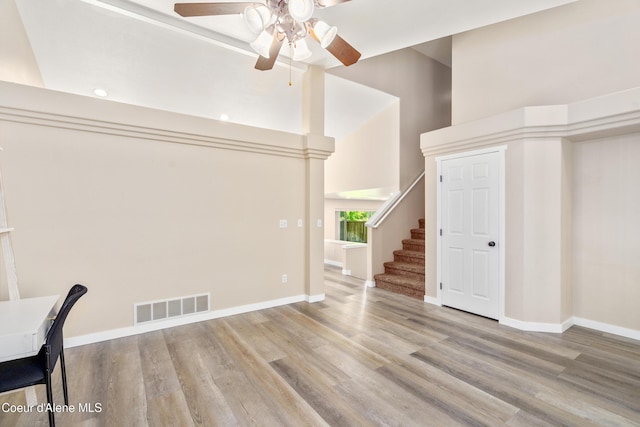 1800 N Willamette Dr, Post Falls, ID 83854 - unfurnished office featuring ceiling fan, wood finished floors, baseboards, and a high ceiling