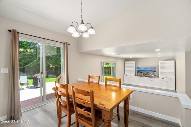 1800 N Willamette Dr, Post Falls, ID 83854 - dining area featuring wood finished floors, a chandelier, and baseboards