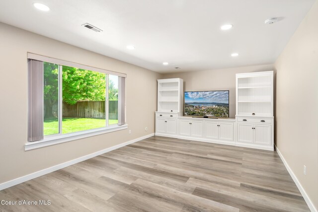 1800 N Willamette Dr, Post Falls, ID 83854 - unfurnished living room featuring light wood-style floors, recessed lighting, and baseboards