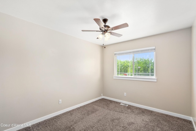 1800 N Willamette Dr, Post Falls, ID 83854 - spare room with carpet floors, baseboards, and a ceiling fan