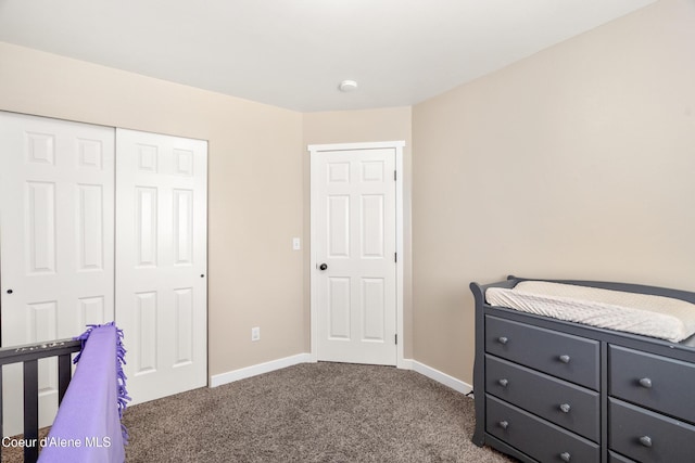 1800 N Willamette Dr, Post Falls, ID 83854 - bedroom with dark colored carpet, baseboards, and a closet