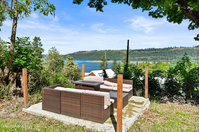 108 E Lincoln Ct, Harrison, ID 83833 - view of patio / terrace with a wooded view, a water view, and an outdoor hangout area