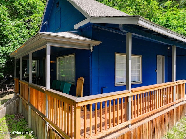 108 E Lincoln Ct, Harrison, ID 83833 - view of side of property featuring roof with shingles and covered porch