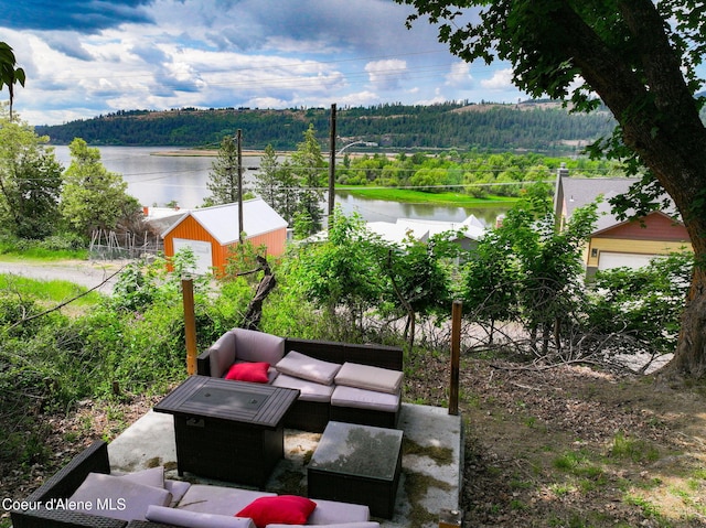 108 E Lincoln Ct, Harrison, ID 83833 - view of patio / terrace featuring a view of trees, a water view, and an outdoor hangout area
