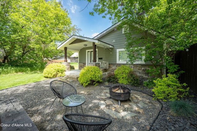924 N 6th St, Coeur Dalene, ID 83814 - view of patio featuring an outdoor fire pit
