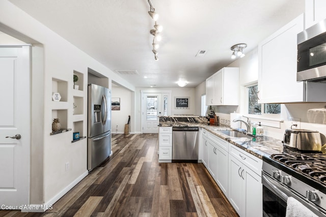 924 N 6th St, Coeur Dalene, ID 83814 - kitchen featuring stainless steel appliances, light stone counters, a sink, white cabinets, and dark wood-type flooring