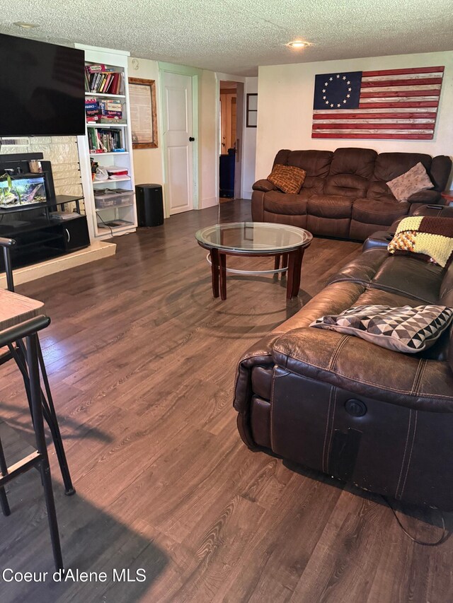 30625 Pastime St, Athol, ID 83801 - living room featuring wood finished floors and a textured ceiling