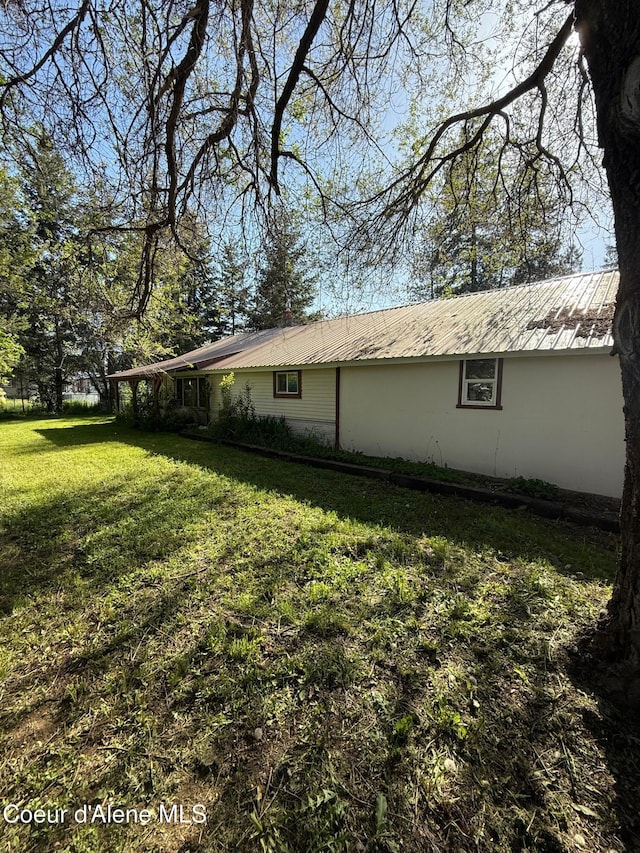 30625 Pastime St, Athol, ID 83801 - view of property exterior with a lawn and metal roof