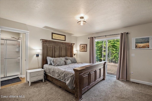 12671 E Trout Pond Rd, Athol, ID 83801 - bedroom featuring access to exterior, light colored carpet, a textured ceiling, and baseboards
