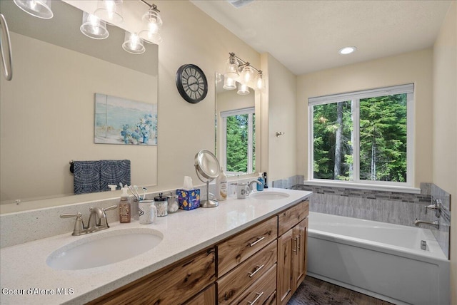 12671 E Trout Pond Rd, Athol, ID 83801 - bathroom featuring double vanity and a garden tub