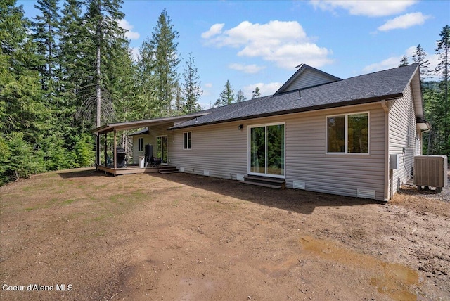 12671 E Trout Pond Rd, Athol, ID 83801 - rear view of house with central AC and a shingled roof
