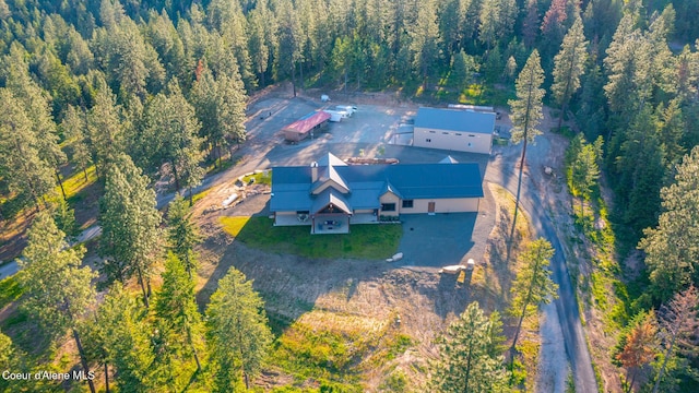 9057 W Benton Way, Coeur Dalene, ID 83814 - aerial view of property and surrounding area featuring a heavily wooded area