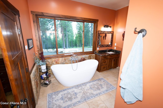 9057 W Benton Way, Coeur Dalene, ID 83814 - full bath with a freestanding tub, vanity, and tile patterned flooring