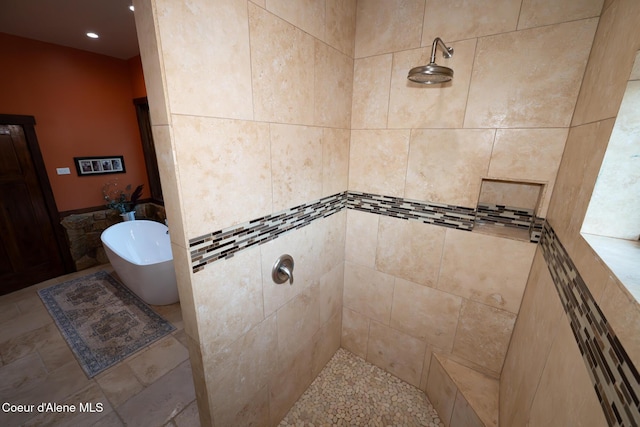 9057 W Benton Way, Coeur Dalene, ID 83814 - bathroom with a freestanding bath, tiled shower, and recessed lighting