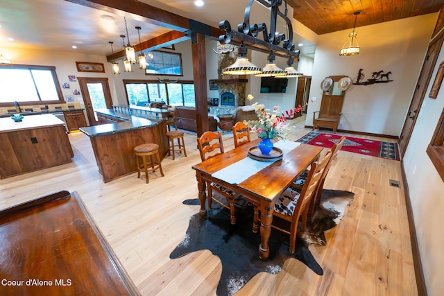 9057 W Benton Way, Coeur Dalene, ID 83814 - dining space with light wood-type flooring, healthy amount of natural light, recessed lighting, and wood ceiling