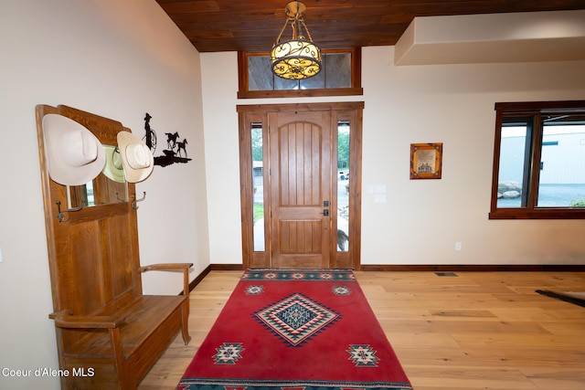 9057 W Benton Way, Coeur Dalene, ID 83814 - foyer entrance with light wood-style floors, wood ceiling, and baseboards