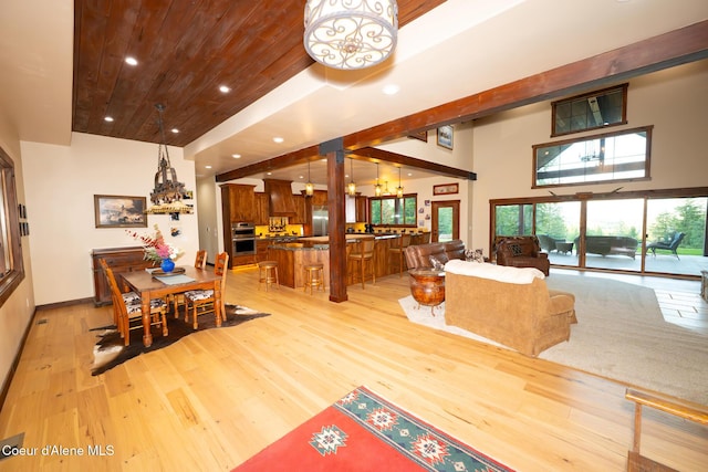 9057 W Benton Way, Coeur Dalene, ID 83814 - dining area with light wood-style floors, recessed lighting, wooden ceiling, a chandelier, and baseboards