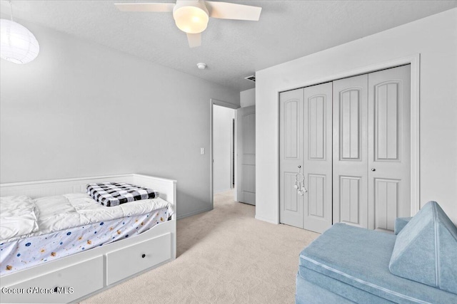 1482 N Skykomish Dr, Post Falls, ID 83854 - bedroom with carpet, a closet, a ceiling fan, and a textured ceiling