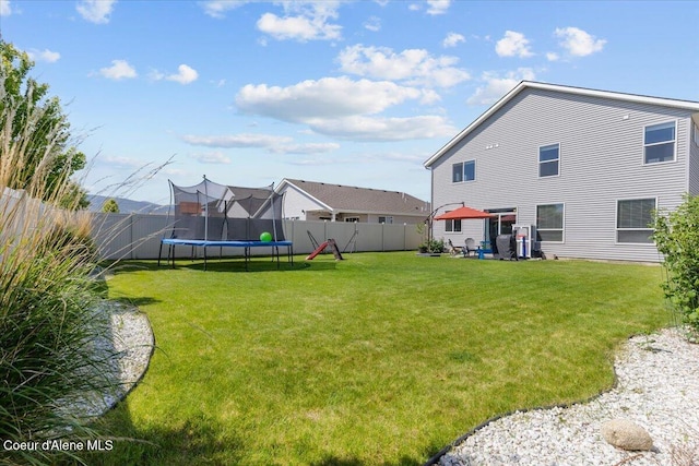 1482 N Skykomish Dr, Post Falls, ID 83854 - view of yard featuring a trampoline