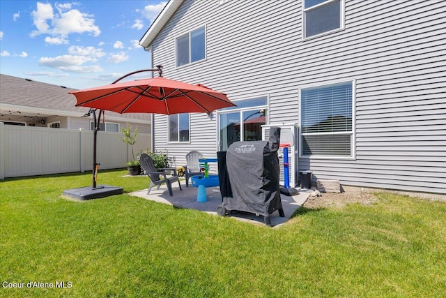 1482 N Skykomish Dr, Post Falls, ID 83854 - rear view of house with a patio area